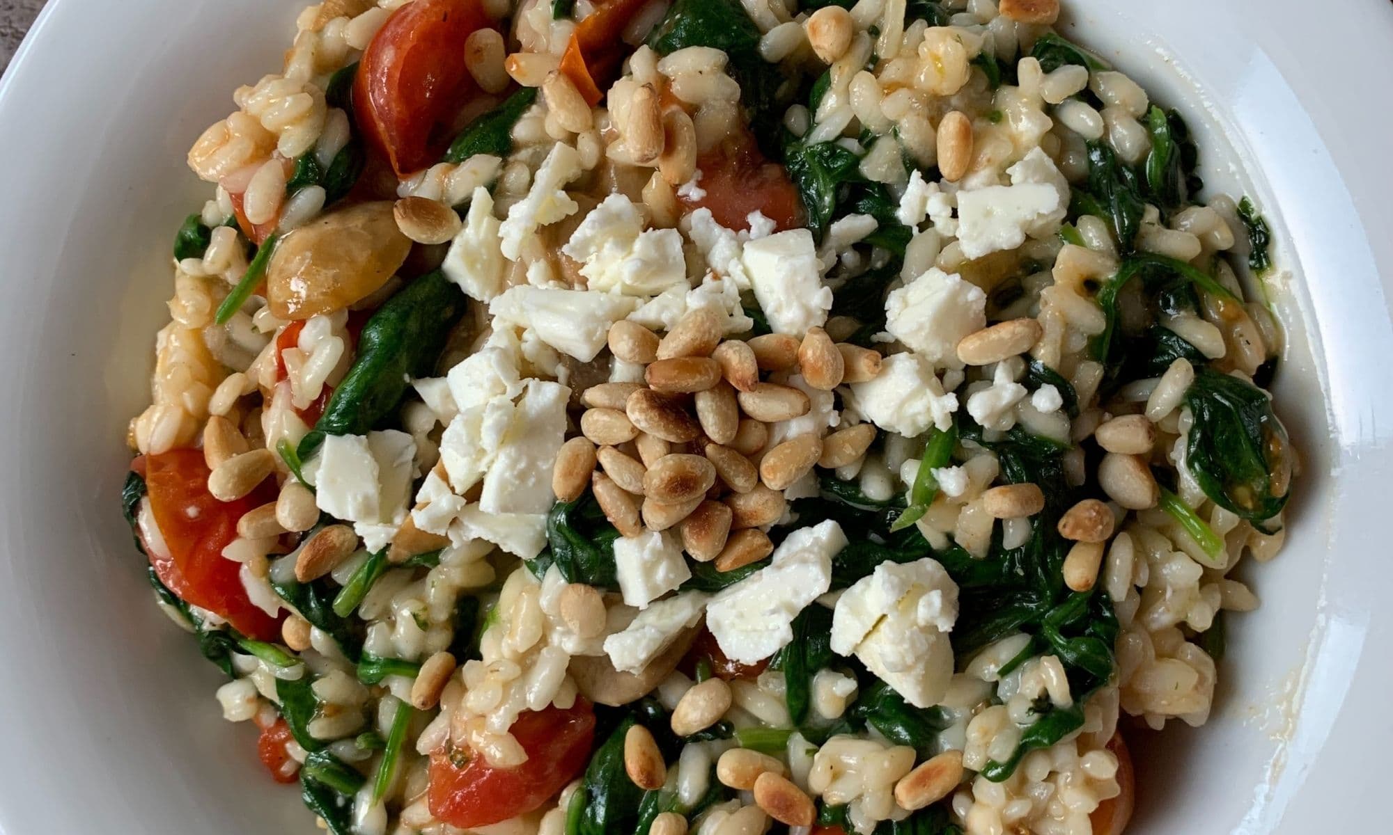 Spinazie risotto met tomaatjes en fetakaas